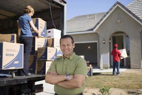 Vehicle and moving team preparing for a man and van service