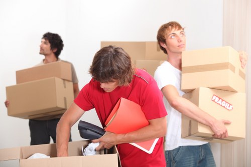 Packed moving boxes and wrapping materials prepared for a Shoreditch home move
