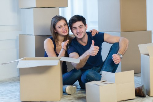 Professional movers handling furniture and boxes for a Shoreditch flat or office