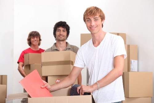 Loading office furniture into a removals vehicle in Shoreditch